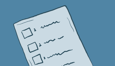 A hand checks off different bullet points on a sheet of paper